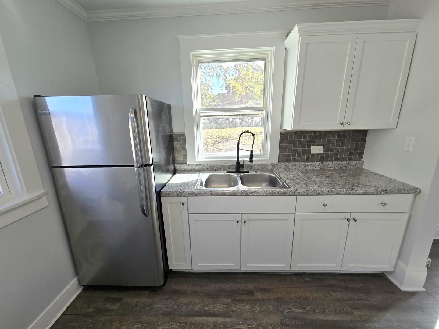 328 Rosewood Avenue Aurora, IL 60505 - Photo 9 of 24 a kitchen with stainless steel appliances granite countertop a refrigerator sink and white cabinets