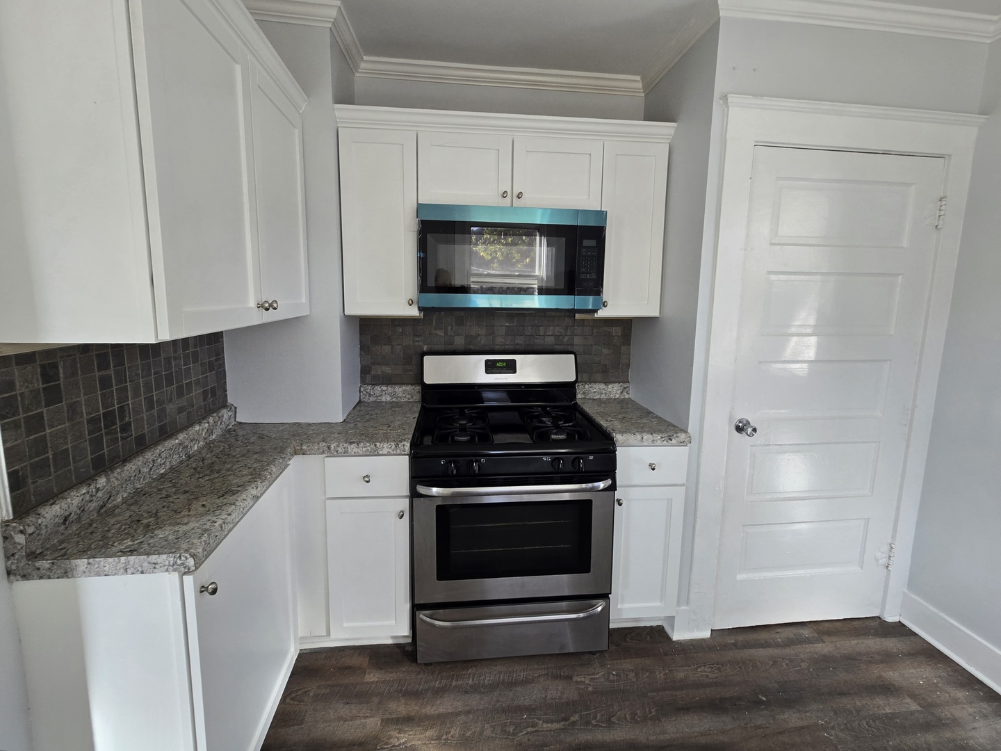 328 Rosewood Avenue Aurora, IL 60505 - Photo 10 of 24 a kitchen with granite countertop a stove and a sink