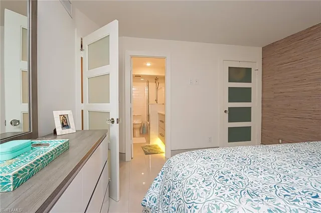 a bedroom with a bed and a dresser