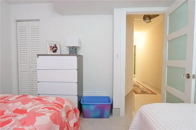 a bedroom with a bed and a cabinets