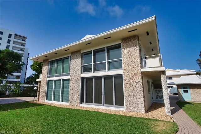a view of an house with backyard porch and fireplace