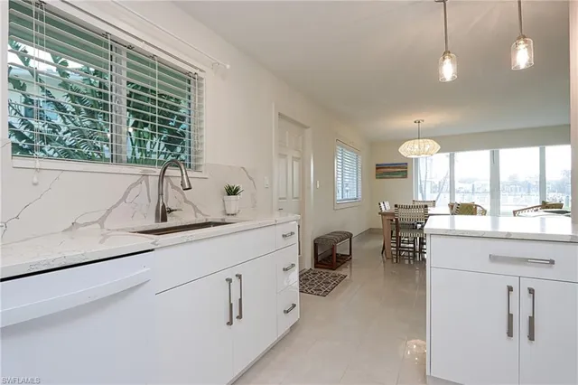 a view of living room with furniture and window