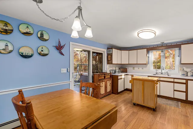 a kitchen with cabinets a sink and appliances