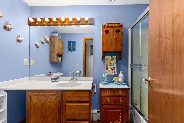 a bathroom with a sink and a mirror