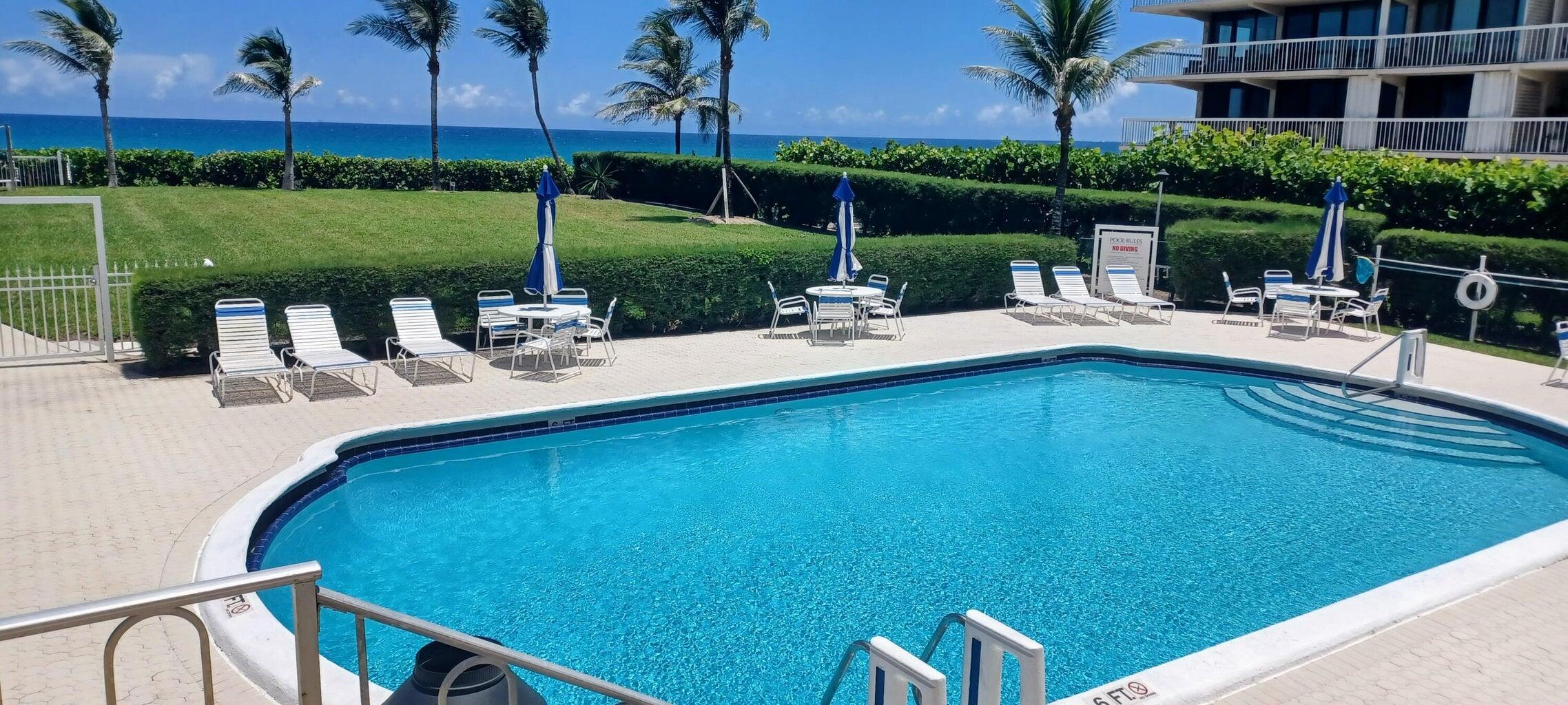 3230 South Ocean Boulevard, Unit E610 Palm Beach, FL 33480 - Photo 14 of 31 a view of a swimming pool with a patio