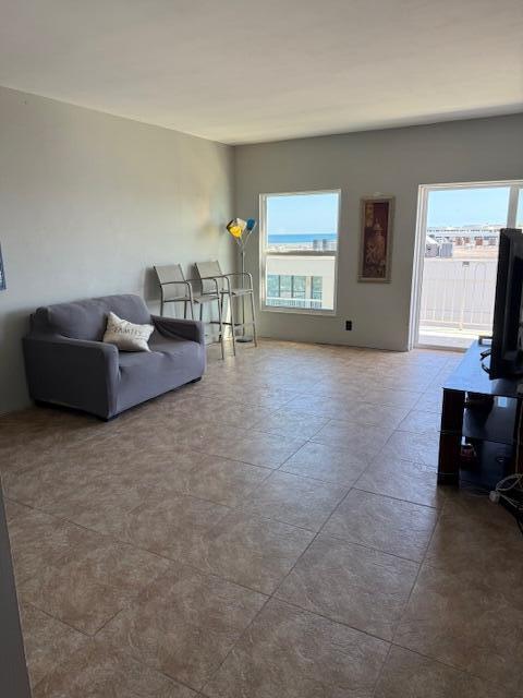 3230 South Ocean Boulevard, Unit E610 Palm Beach, FL 33480 - Photo 22 of 31 a living room with furniture and a flat screen tv