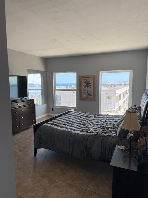 3230 South Ocean Boulevard, Unit E610 Palm Beach, FL 33480 - Photo 26 of 31 a bedroom with a bed and a television