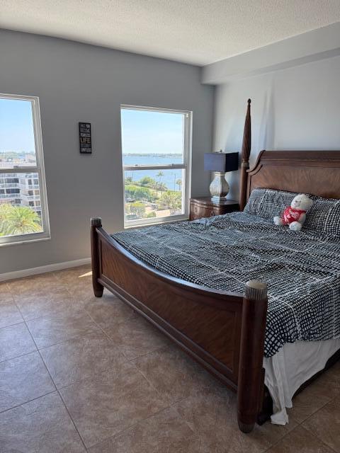 3230 South Ocean Boulevard, Unit E610 Palm Beach, FL 33480 - Photo 28 of 31 a bedroom with a bed and a window