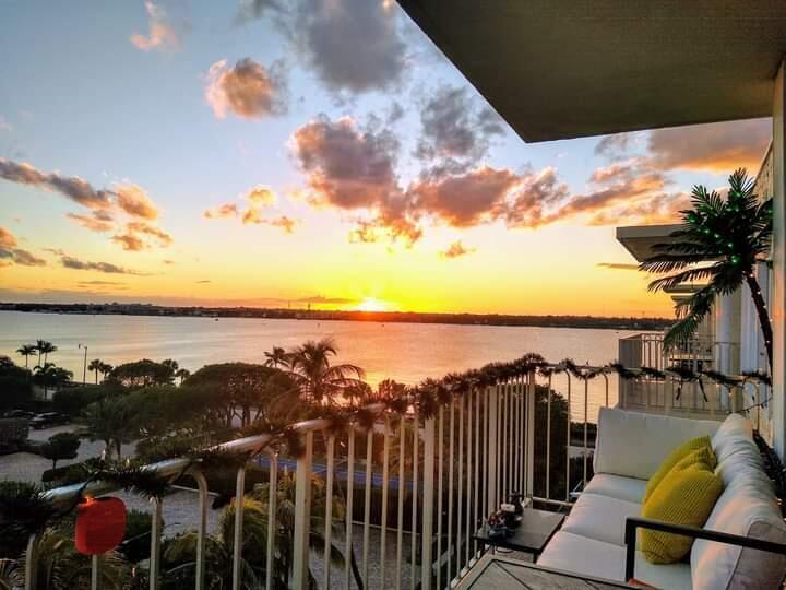 3230 South Ocean Boulevard, Unit E610 Palm Beach, FL 33480 - Photo 7 of 31 a view of a lake with a mountain in the background