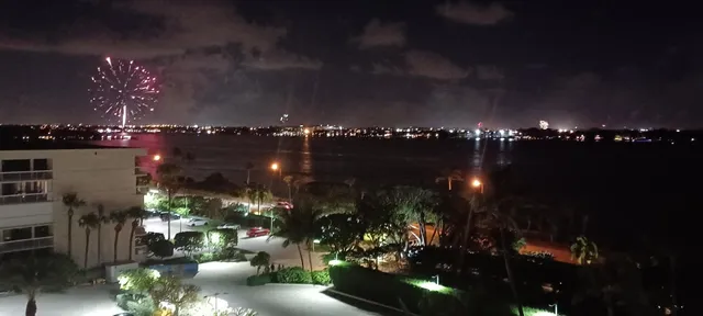 a view of a tall building with a yard