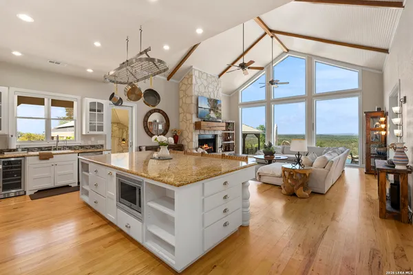 a kitchen with stainless steel appliances granite countertop a stove and cabinets