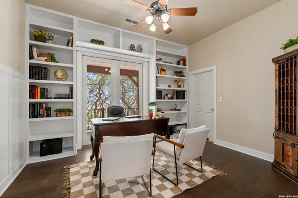 a dining room with furniture fire place and a window