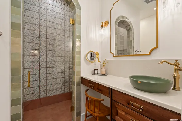 a bathroom with a sink and a mirror