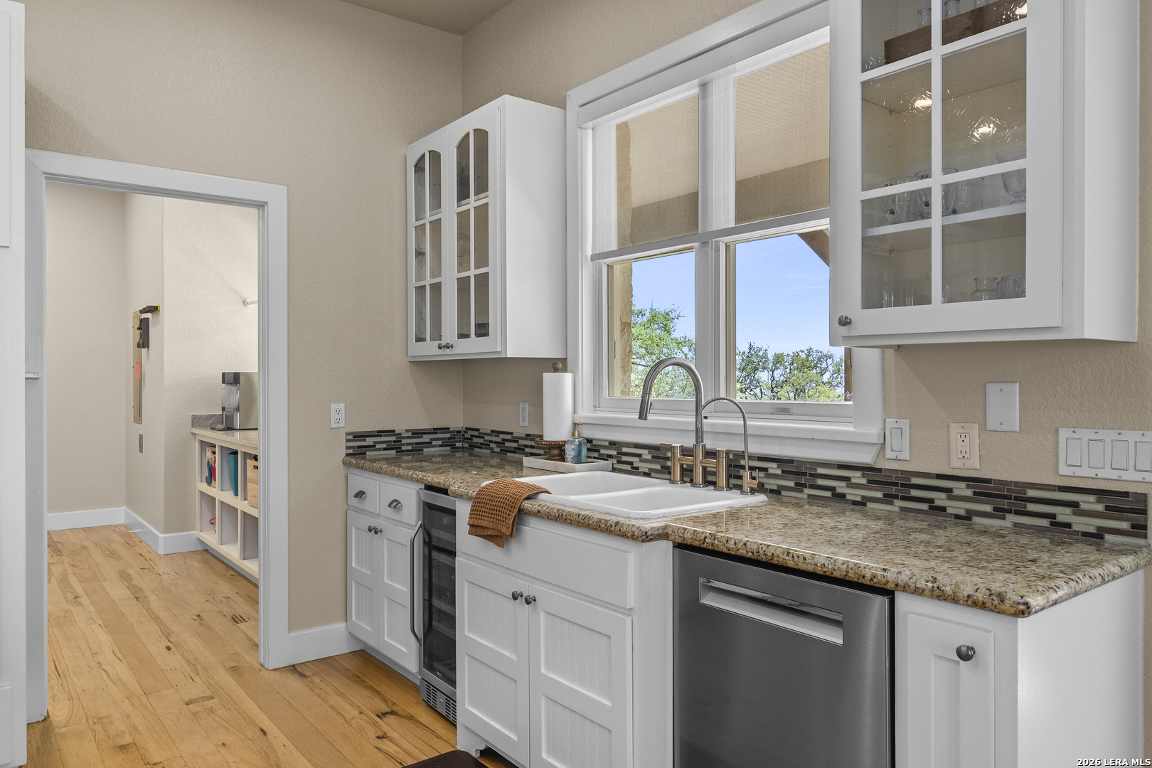 140 Kuntz Run Bulverde, TX 78163 - Photo 16 of 49 a kitchen with a sink stove and cabinets