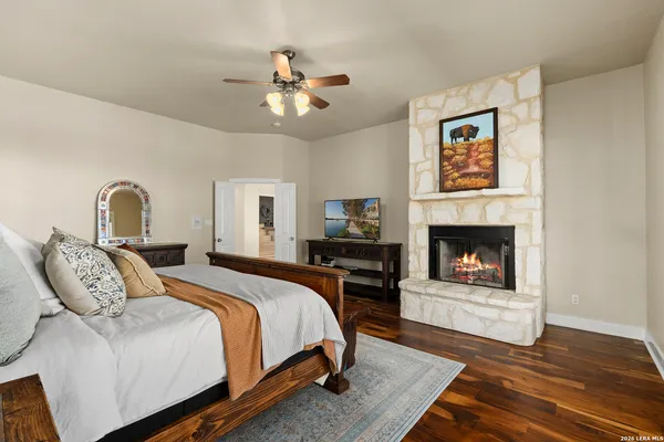 a bedroom with a bed and a fireplace
