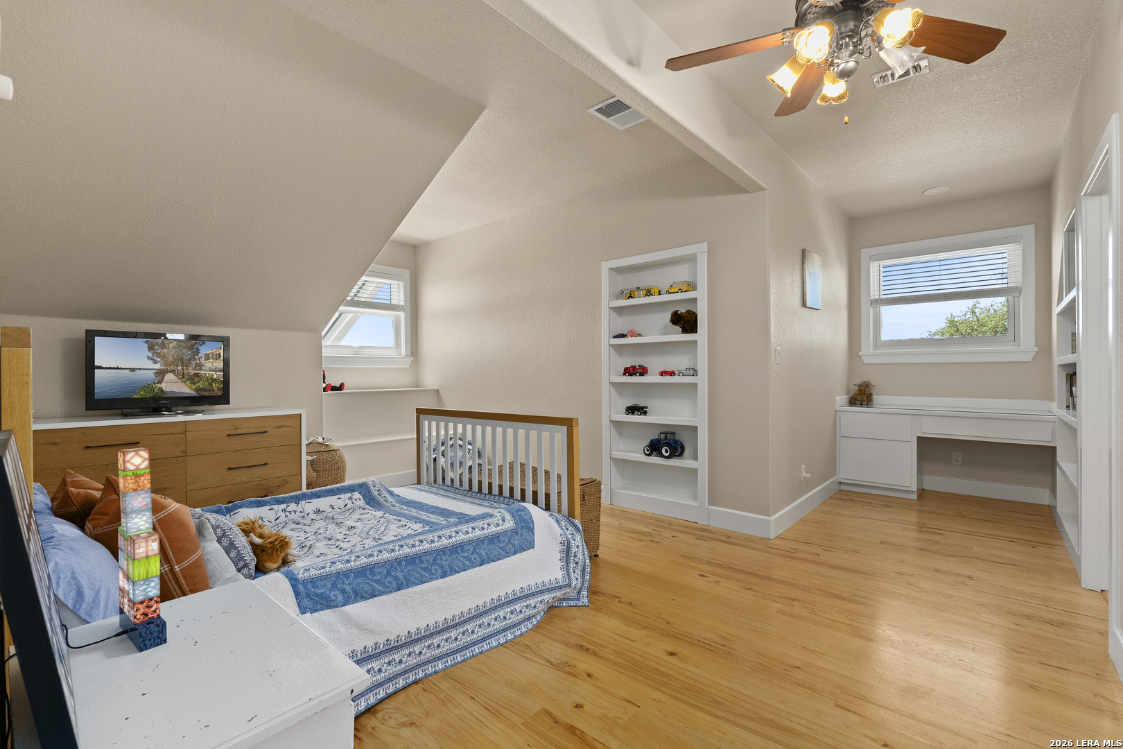 140 Kuntz Run Bulverde, TX 78163 - Photo 20 of 49 a bedroom with furniture and wooden floor