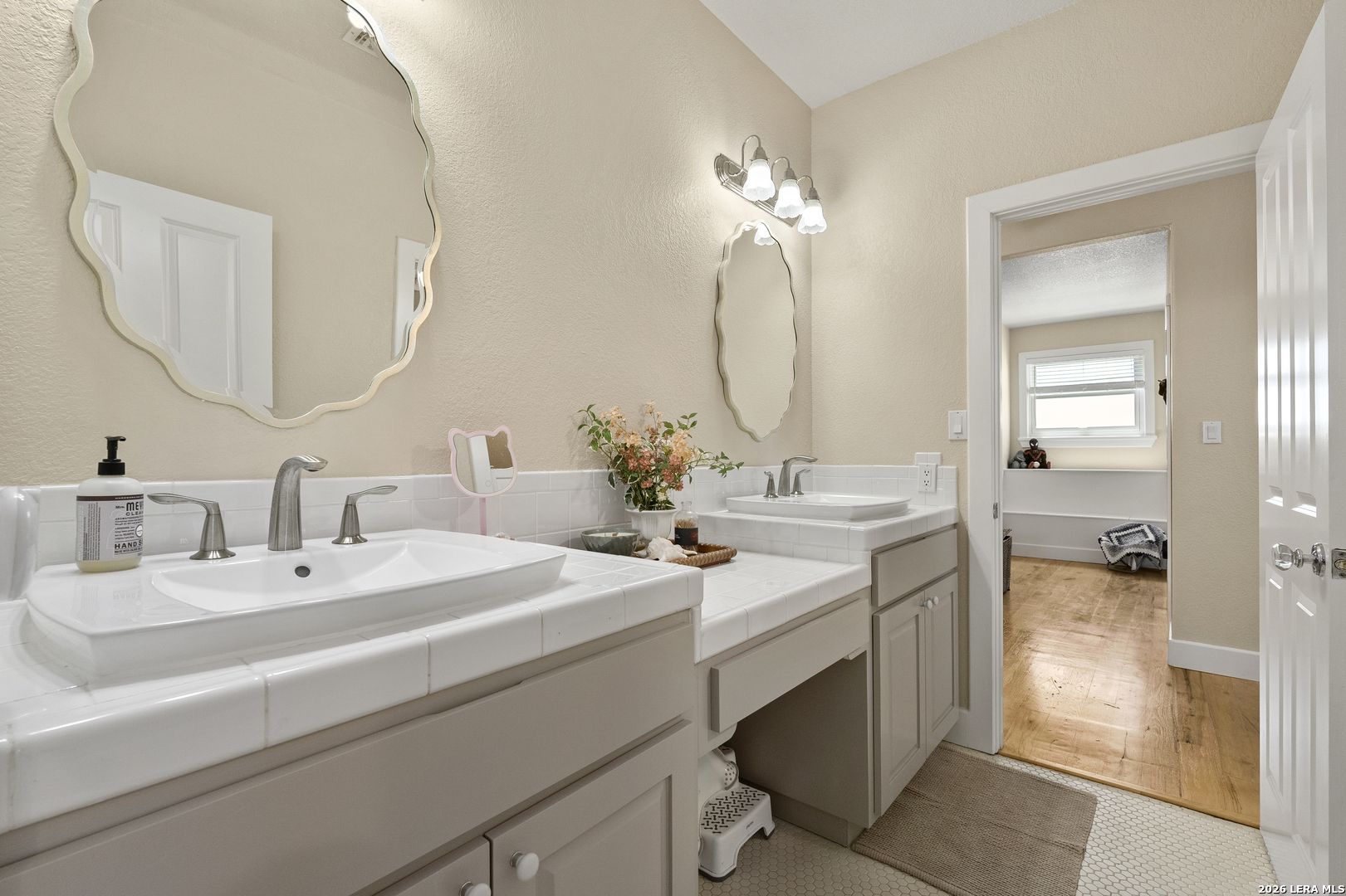140 Kuntz Run Bulverde, TX 78163 - Photo 21 of 49 a bathroom with a double vanity sink mirror and