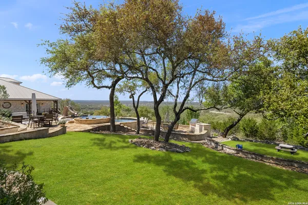 a view of a park with large trees