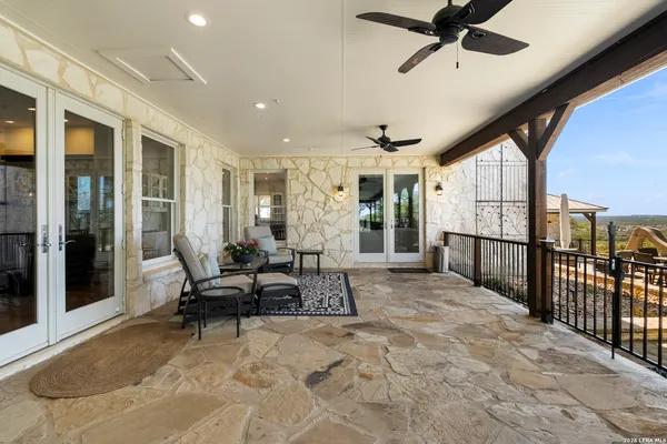 a view of a livingroom with furniture and a ceiling fan