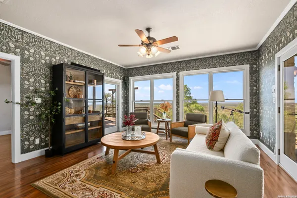 a view of a dining room with furniture window and wooden floor