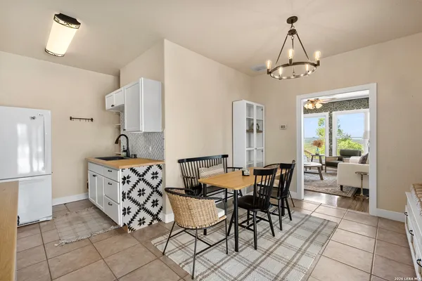 a spacious bedroom with a bed and a large window