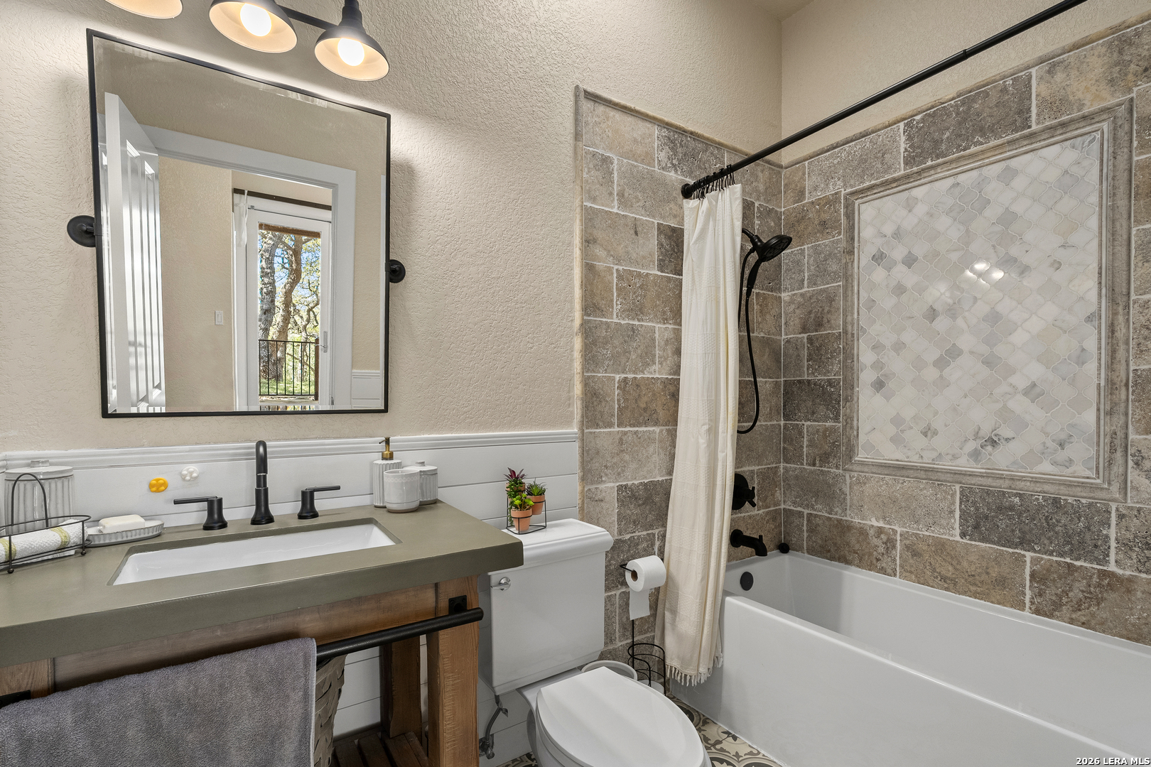 140 Kuntz Run Bulverde, TX 78163 - Photo 37 of 49 a bathroom with a sink a toilet and shower