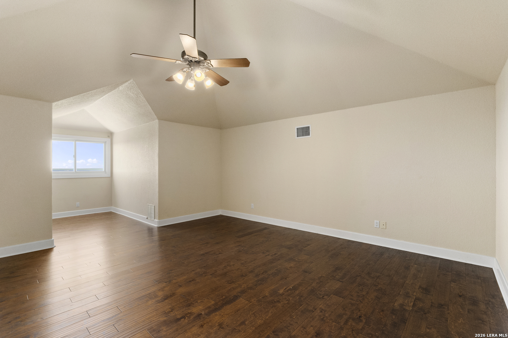 140 Kuntz Run Bulverde, TX 78163 - Photo 38 of 49 an empty room with wooden floor fan and windows
