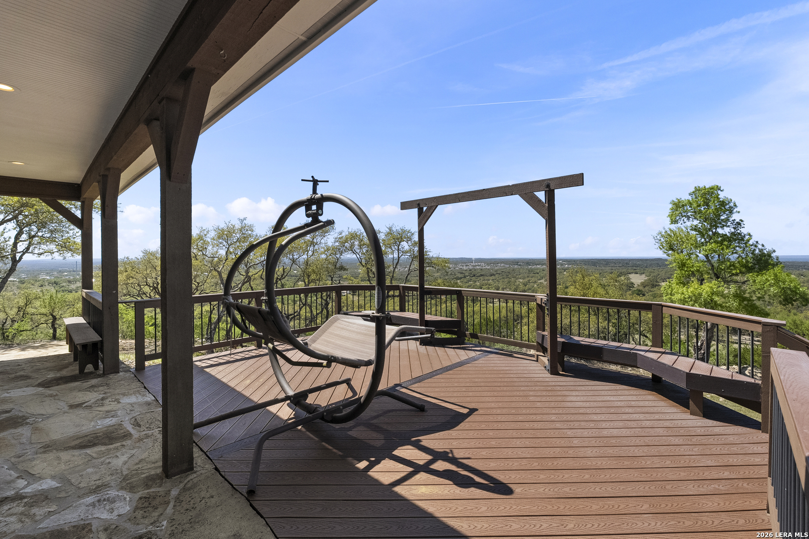140 Kuntz Run Bulverde, TX 78163 - Photo 39 of 49 a view of a balcony with chairs and wooden floor