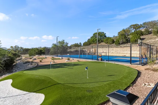 a view of swimming pool with outdoor seating