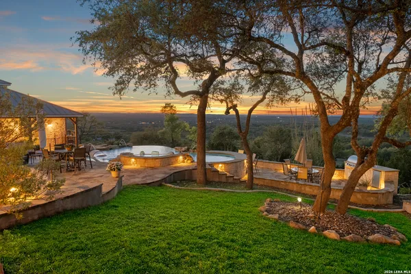 a aerial view of a house with swimming pool garden and patio