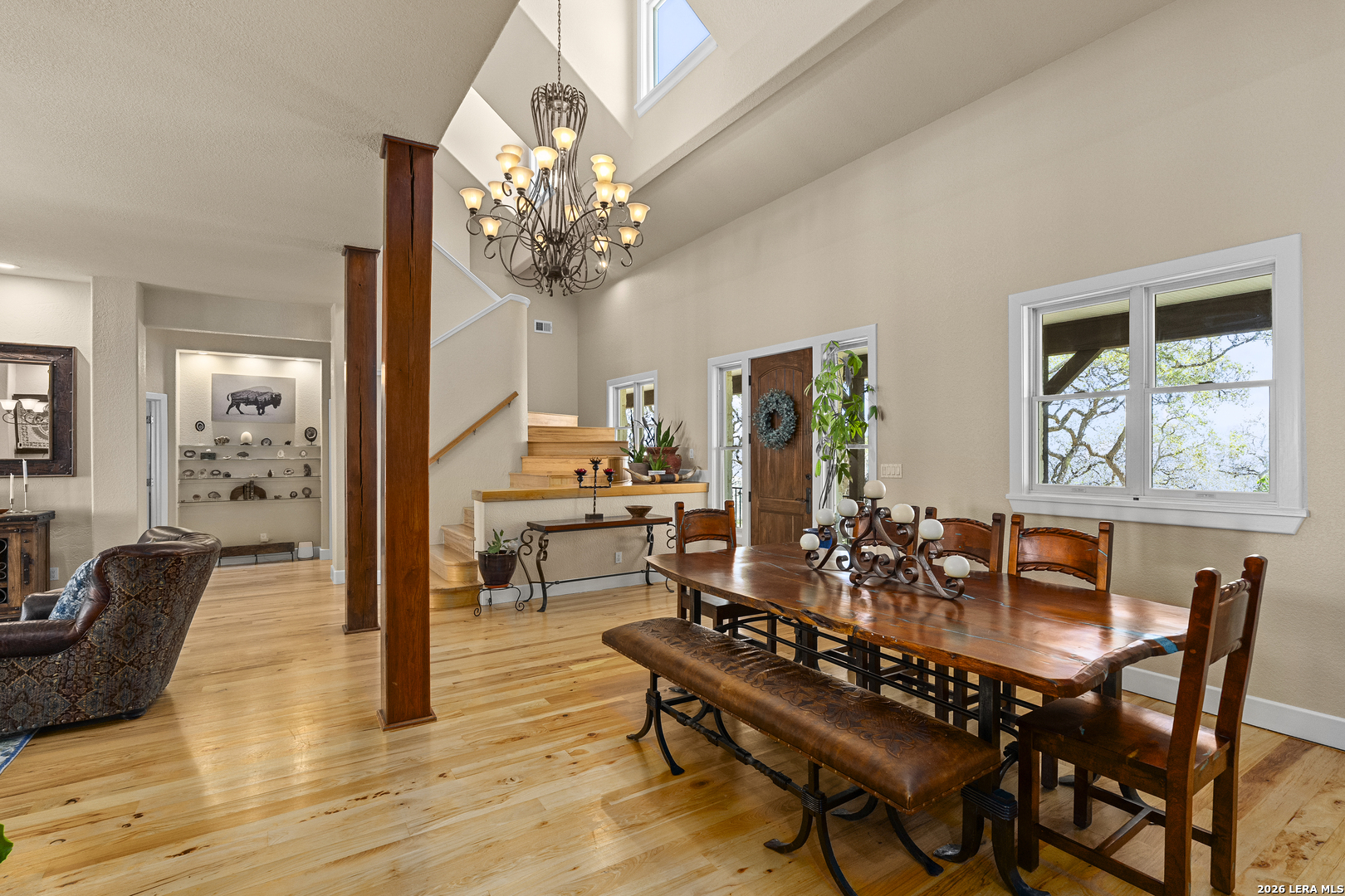 140 Kuntz Run Bulverde, TX 78163 - Photo 7 of 49 a view of a dining room with furniture wooden floor and chandelier