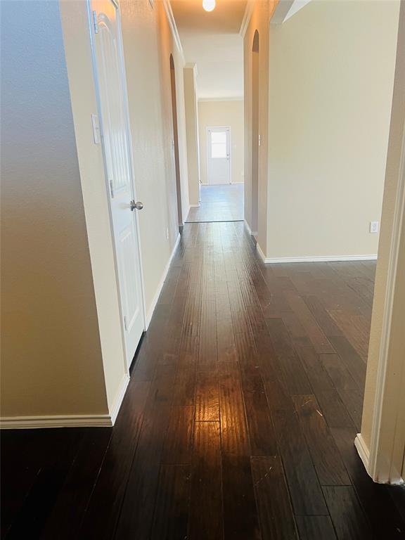 509 Trailblazer Road Forney, TX 75126 - Photo 9 of 13 a view of a hallway with wooden floor
