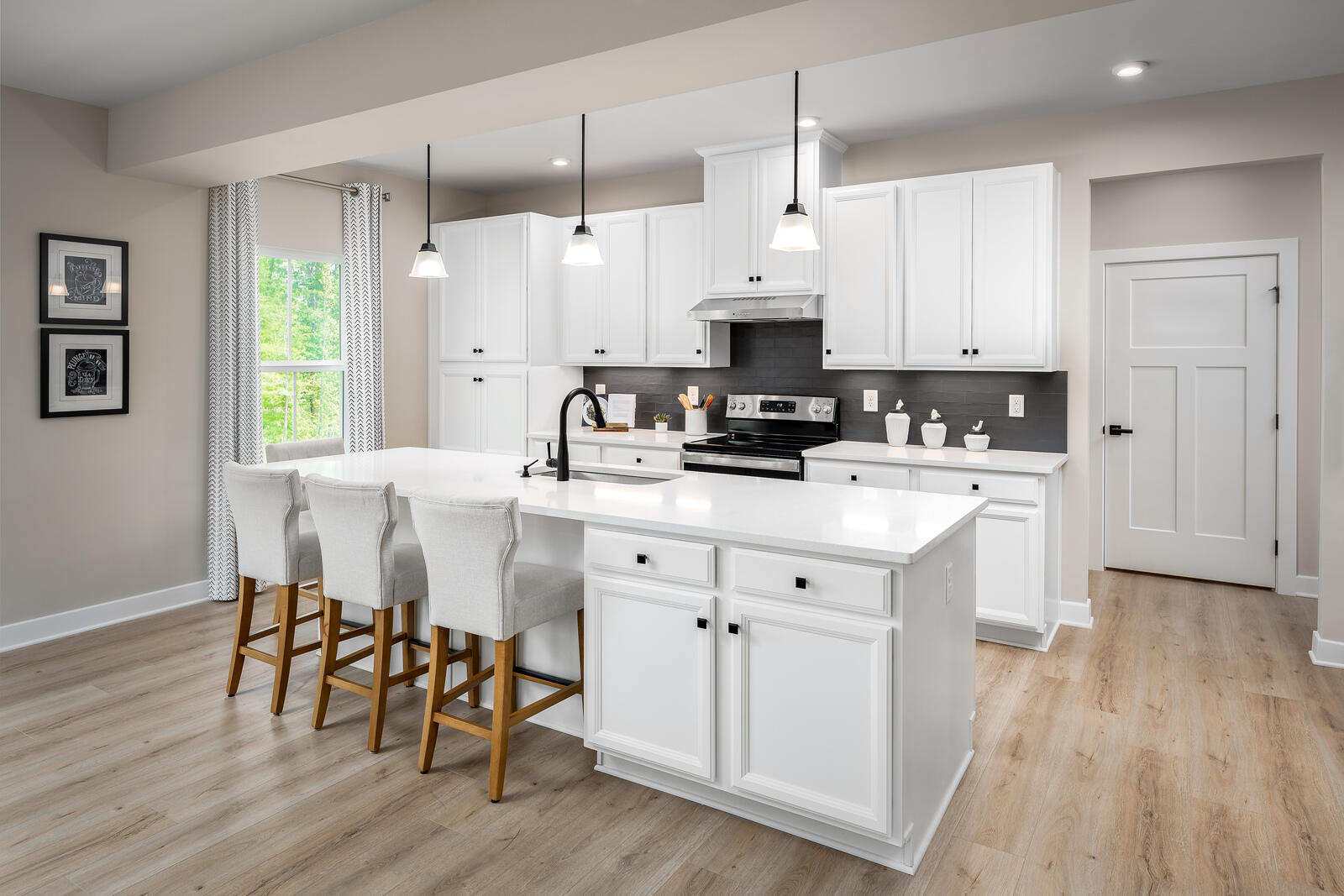7058 Fairway Ridge Road Salem, VA 24153 - Photo 51 of 74 a kitchen with stainless steel appliances a white table chairs and a refrigerator