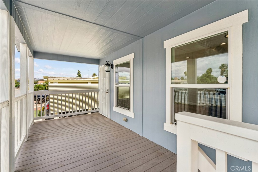 10550 Dunlap Crossing Road, Unit 141 Whittier, CA 90606 - Photo 4 of 38 a view of a balcony with wooden floor