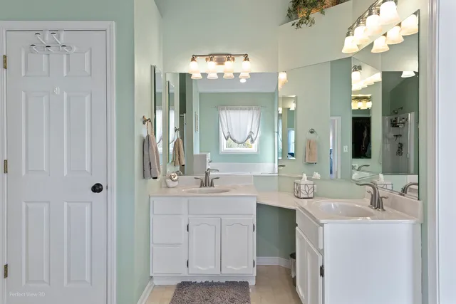 a bathroom with a sink vanity and a mirror