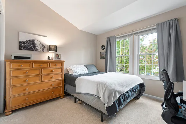 a bedroom with a bed and furniture