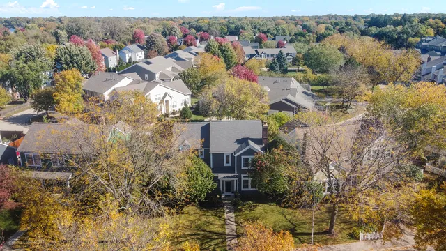 an aerial view of a house with a yard