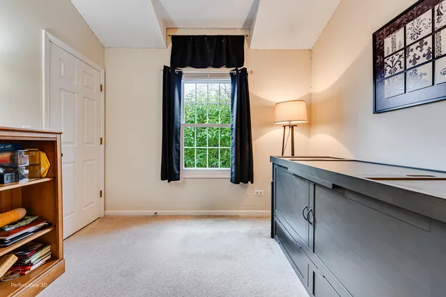 a very nice looking room with a large window and a walk in closet