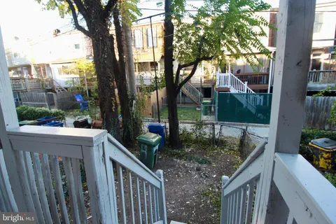 a balcony view with a sink and garden view