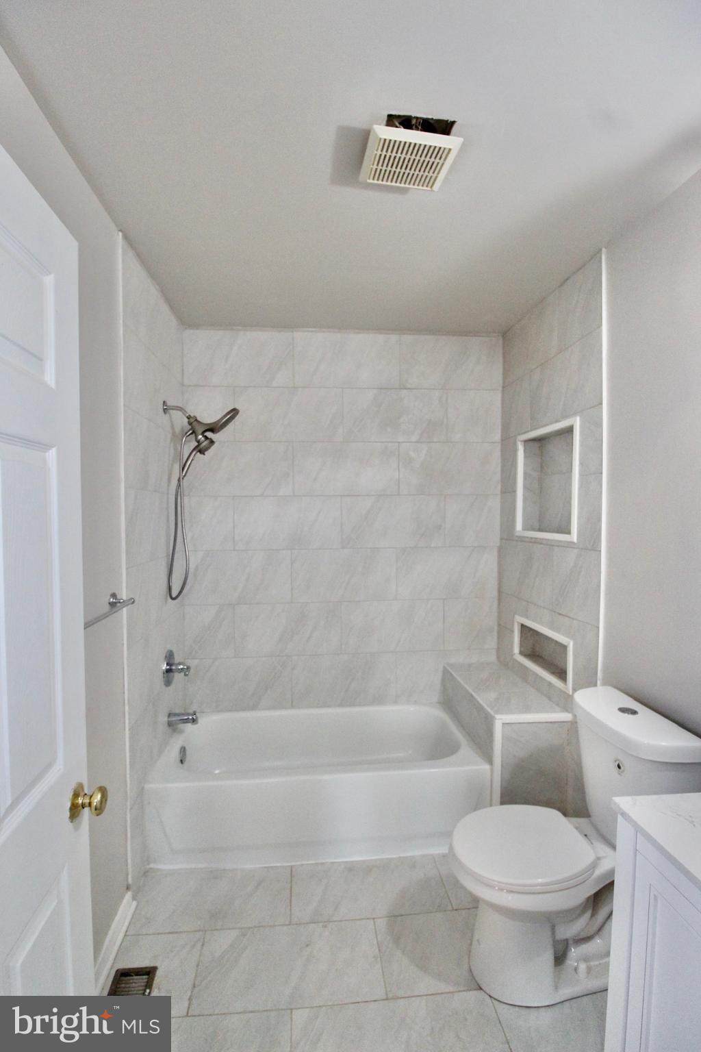 434 East 28th Street Baltimore, MD 21218 - Photo 27 of 37 a bathroom with a toilet and a shower