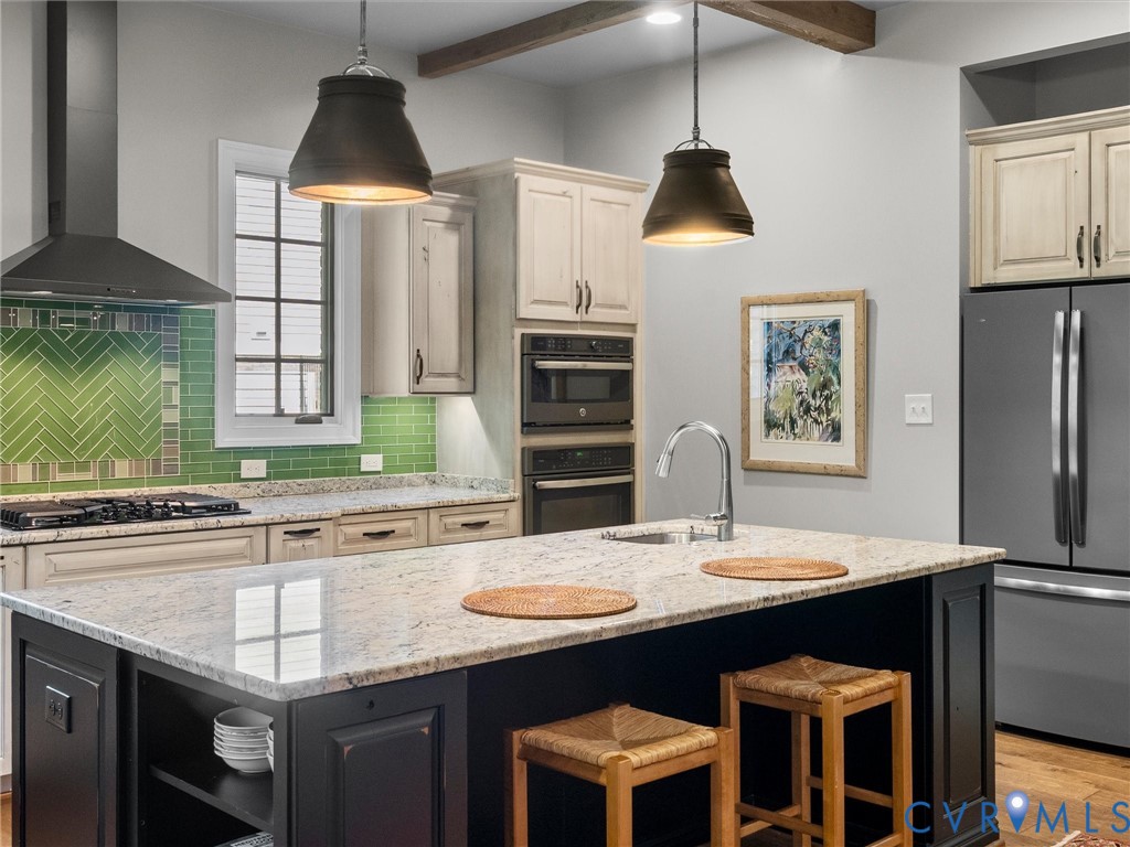16131 Binley Road Midlothian, VA 23112 - Photo 35 of 99 a kitchen with granite countertop a sink stainless steel appliances and a chandelier