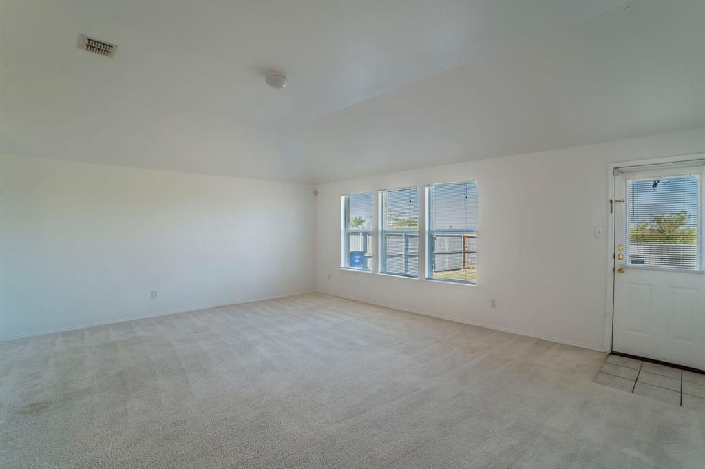 6333 Pool View Drive Dallas, TX 75249 - Photo 11 of 37 an empty room with windows