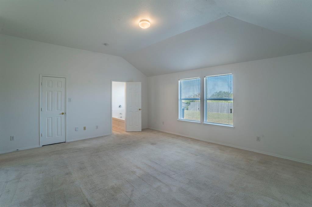 6333 Pool View Drive Dallas, TX 75249 - Photo 20 of 37 an empty room with windows