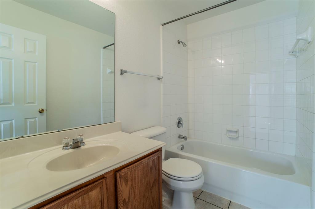 6333 Pool View Drive Dallas, TX 75249 - Photo 27 of 37 a bathroom with a sink and a bathtub