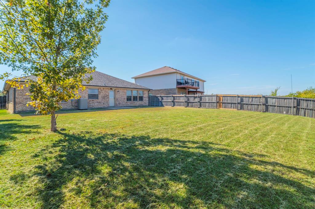 6333 Pool View Drive Dallas, TX 75249 - Photo 34 of 37 a view of a house with a yard