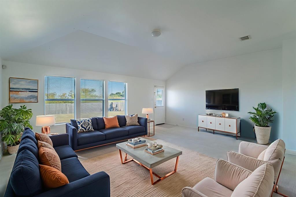 6333 Pool View Drive Dallas, TX 75249 - Photo 4 of 37 a living room with furniture and a flat screen tv