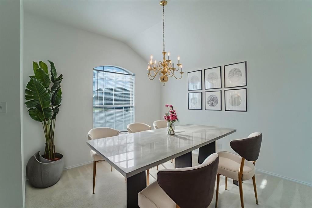 6333 Pool View Drive Dallas, TX 75249 - Photo 5 of 37 a view of a dining room with furniture window and wooden floor