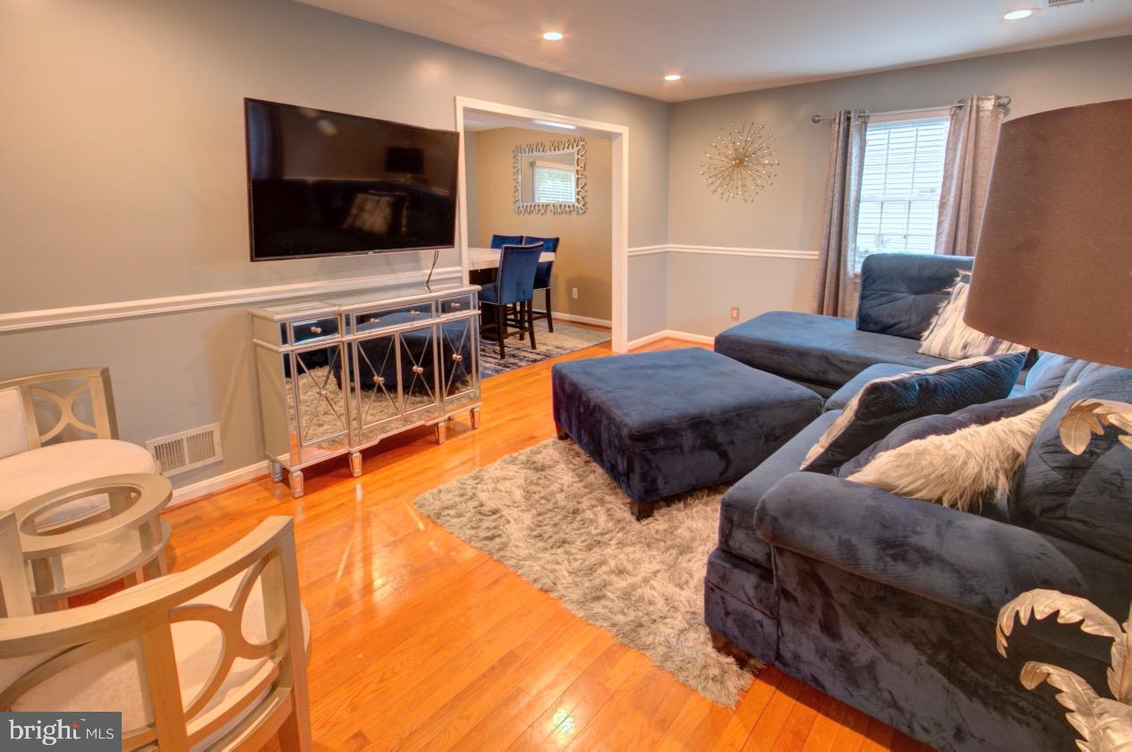 9015 Horton Road Laurel, MD 20708 - Photo 11 of 33 a living room with furniture and a flat screen tv