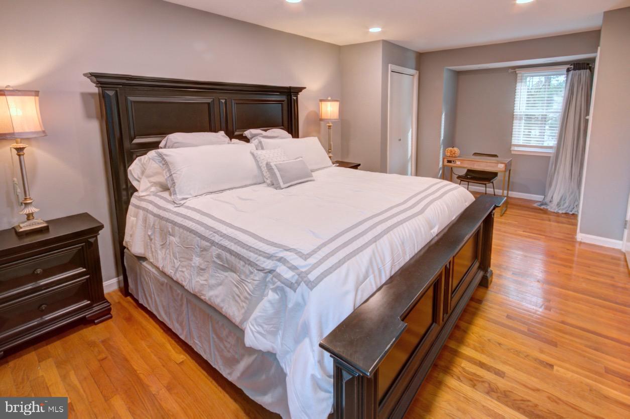 9015 Horton Road Laurel, MD 20708 - Photo 19 of 33 a bedroom with bed and wooden floor