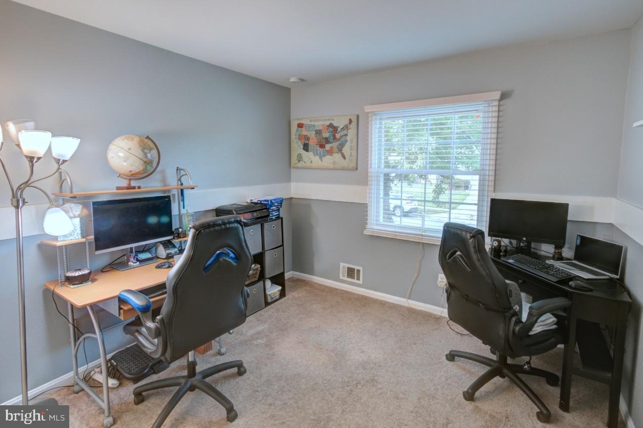 9015 Horton Road Laurel, MD 20708 - Photo 22 of 33 a view of a workspace with furniture and a window